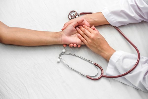 hand-doctor-reassuring-her-female-patient